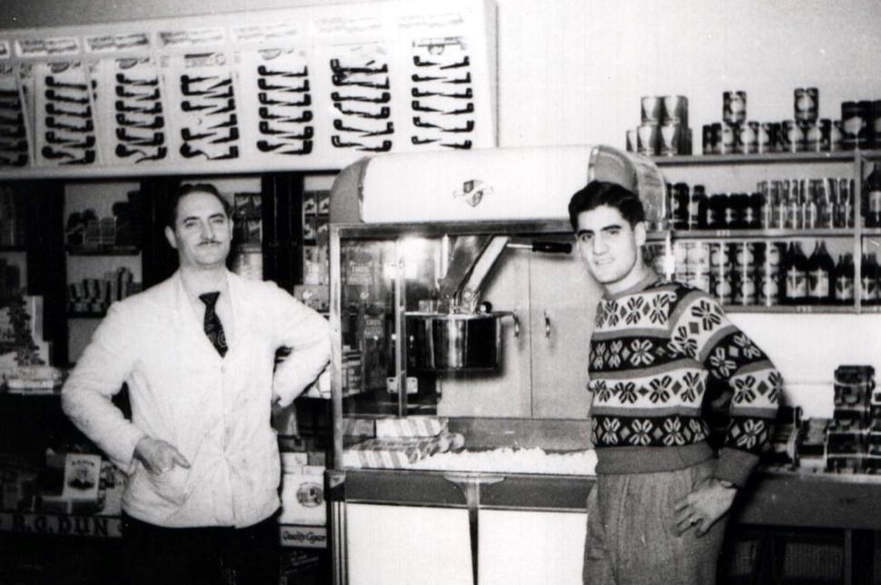 Black and white photograph of two men, Caroline's grandfather and great-grandfather, standing in their family grocery store